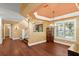 Elegant dining room features hardwood floors, staircase, a chandelier, and large windows at 6317 Palmas Bay Cir, Port Orange, FL 32127