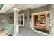 Charming home exterior features a welcoming front entrance with double doors, inviting curb appeal and a cozy porch at 6317 Palmas Bay Cir, Port Orange, FL 32127