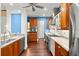 Bright kitchen with granite countertops, stainless steel appliances, and modern cabinetry at 6317 Palmas Bay Cir, Port Orange, FL 32127