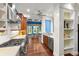 Well-equipped kitchen with granite counters, stainless appliances, and an adjacent dining area at 6317 Palmas Bay Cir, Port Orange, FL 32127