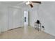 This bedroom has tile flooring, neutral paint, and a closet with double doors at 636 W Mathis St, Deland, FL 32720