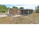 Charming brick home with a screened in porch and adjacent parking at 636 W Mathis St, Deland, FL 32720