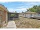 View of the exterior elevation featuring a screened in porch and adjacent structure at 636 W Mathis St, Deland, FL 32720