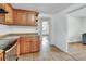 Kitchen showcasing wood cabinets, tile flooring, and stainless steel oven at 636 W Mathis St, Deland, FL 32720