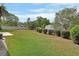 Spacious green backyard with mature trees and plenty of room for outdoor activities at 672 Swarthmore Dr, Deland, FL 32724