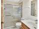 Clean bathroom with a glass-enclosed shower and classic vanity at 672 Swarthmore Dr, Deland, FL 32724