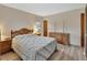 Inviting bedroom featuring shuttered windows, wood-look floors and classic decor at 672 Swarthmore Dr, Deland, FL 32724