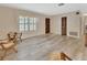 Hardwood floors and natural light make this living space a comfortable place to relax at 672 Swarthmore Dr, Deland, FL 32724
