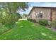 Side yard featuring lush green grass and well-maintained landscaping at 672 Swarthmore Dr, Deland, FL 32724