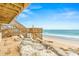 Scenic view of a backyard deck by the beach, under a blue sky at 6847 S Atlantic Ave, New Smyrna Beach, FL 32169