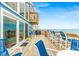 Spacious outdoor living with ample deck seating and beautiful ocean views at 6847 S Atlantic Ave, New Smyrna Beach, FL 32169