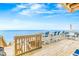 Large outdoor deck overlooking ocean with an array of seating options at 6847 S Atlantic Ave, New Smyrna Beach, FL 32169