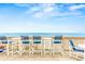 Outdoor deck featuring barstool seating perfect for enjoying ocean views at 6847 S Atlantic Ave, New Smyrna Beach, FL 32169