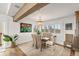 Bright dining area featuring large windows and stylish decor at 6847 S Atlantic Ave, New Smyrna Beach, FL 32169
