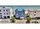 Charming blue beachfront home with a metal roof and an ocean view at 6847 S Atlantic Ave, New Smyrna Beach, FL 32169