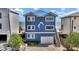 Coastal home showcasing blue siding, white trim, and convenient garage access at 6847 S Atlantic Ave, New Smyrna Beach, FL 32169