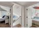 Hallway view showcasing access to bedrooms with beachy decor and ocean views at 6847 S Atlantic Ave, New Smyrna Beach, FL 32169
