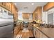 Well-equipped kitchen with stainless steel appliances and ample cabinet space at 6847 S Atlantic Ave, New Smyrna Beach, FL 32169