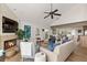 Cozy living room with fireplace, comfortable seating, and an open floor plan connecting to the kitchen at 6847 S Atlantic Ave, New Smyrna Beach, FL 32169