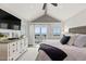 Bright main bedroom boasts ocean view, vaulted ceiling, and updated furniture at 6847 S Atlantic Ave, New Smyrna Beach, FL 32169