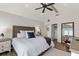 A well-lit primary bedroom shows a closet, wood flooring, and white walls at 6847 S Atlantic Ave, New Smyrna Beach, FL 32169