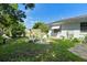 Large backyard featuring a fire pit with chairs and plenty of space to enjoy the outdoors at 708 Wayne Ave, New Smyrna Beach, FL 32168