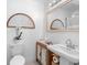 Stylish bathroom features a modern vanity, decorative mirror, and elegant fixtures at 708 Wayne Ave, New Smyrna Beach, FL 32168