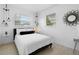 Bright bedroom with windows and modern lighting fixtures, creating a serene atmosphere at 708 Wayne Ave, New Smyrna Beach, FL 32168