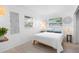 Comfortable bedroom with natural light from the windows and minimalistic decor at 708 Wayne Ave, New Smyrna Beach, FL 32168