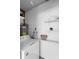 Well-lit laundry room with ample storage space and modern appliances for convenience at 708 Wayne Ave, New Smyrna Beach, FL 32168