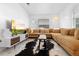 Comfortable living room features a stylish sectional, modern TV stand, and decorative accents at 708 Wayne Ave, New Smyrna Beach, FL 32168