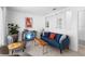 Relaxing living room boasts a blue sofa, side chairs, and stylish decor at 708 Wayne Ave, New Smyrna Beach, FL 32168
