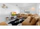 Bright living room featuring modern decor, large windows, and comfortable seating at 708 Wayne Ave, New Smyrna Beach, FL 32168