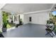 Spacious covered patio with outdoor seating, ideal for entertaining and relaxing in style at 708 Wayne Ave, New Smyrna Beach, FL 32168
