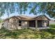 Back exterior of home showcasing yard, roof and window at 801 Coleman Ave, Deltona, FL 32725
