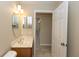 Powder room featuring a marble vanity top at 801 Coleman Ave, Deltona, FL 32725