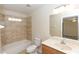 Bathroom featuring tile flooring, tiled shower and bath combo, and a single sink vanity at 801 Coleman Ave, Deltona, FL 32725