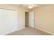 Bedroom featuring neutral-colored walls, carpet flooring, and closet with standard doors at 801 Coleman Ave, Deltona, FL 32725