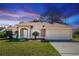 Charming single-story home featuring a well-maintained lawn and a two-car garage at 801 Coleman Ave, Deltona, FL 32725