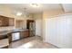 Bright kitchen featuring stainless steel appliances, tile floors, and ample cabinet space at 801 Coleman Ave, Deltona, FL 32725