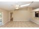 Inviting living room featuring tile floors, a ceiling fan, and bright neutral paint at 801 Coleman Ave, Deltona, FL 32725