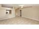 Spacious living room with tile flooring, neutral walls, and an open layout leading to other areas at 801 Coleman Ave, Deltona, FL 32725