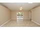 Bright and open living space with tile flooring and sliding glass door to the patio at 801 Coleman Ave, Deltona, FL 32725