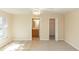 Spacious main bedroom featuring neutral colors, a ceiling fan, a bathroom, and a walk-in closet at 801 Coleman Ave, Deltona, FL 32725