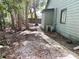 View of the backyard featuring a narrow walkway along the side of the home at 805 N Clake St, Deland, FL 32724