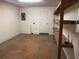 A partially finished basement offers versatile storage with wooden shelving at 805 N Clake St, Deland, FL 32724