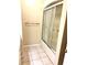Clean bathroom with a glass door shower, towel rack, and beige tiled floor at 805 N Clake St, Deland, FL 32724