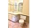 A well-lit bathroom features a single sink vanity, toilet and large mirror at 805 N Clake St, Deland, FL 32724