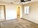 A light-filled bedroom features neutral walls, carpet floors, and a view to an open closet at 805 N Clake St, Deland, FL 32724