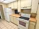 Kitchen showcasing appliances, light-colored cabinets, and countertops at 805 N Clake St, Deland, FL 32724
